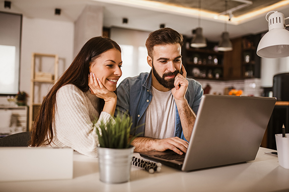 couple at computer attending a telegenetic counseling appointment